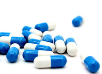 Blue & white capsules in blister strips at HimPharm